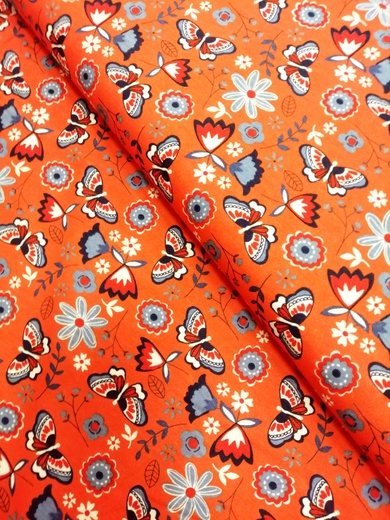 Bavlněný úplet motýli na oranžové 050018